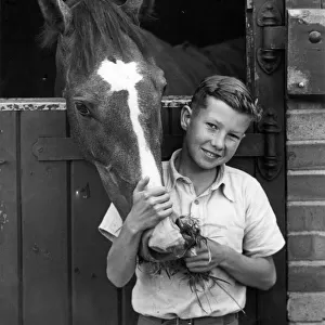 Lester Piggott, racing jockey, aged 12, who has already won his first race