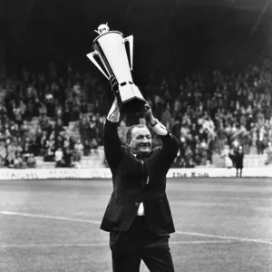 Liverpool manager Bob paisley holds aloft his Manager of the Year Award before the match