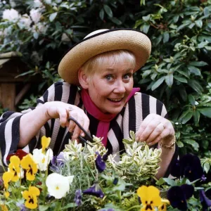 Liz Dawn actress who plays the part of Vera Duckworth in Coronation Street in her garden