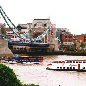 London Tourists on River Buses pass under Tower Bridge