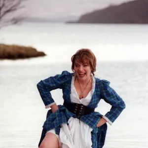 Lorraine Kelly GMTV presenter February 1998 wearing tartan dress wading in Loch