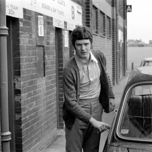 Manchester United footballer Brian Kidd leaves Old Trrfford training in his car following