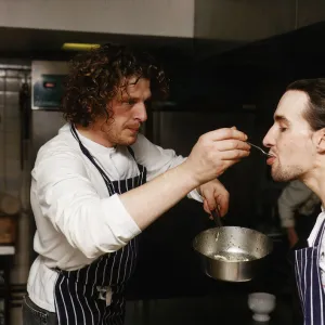 Marco Pierre White Michelin starred chef seen here in his kitchen getting a fellow chef