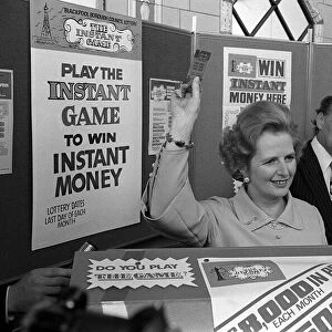Margaret Thatcher October 1977 holds up an instant game ticket at the Conservative Party