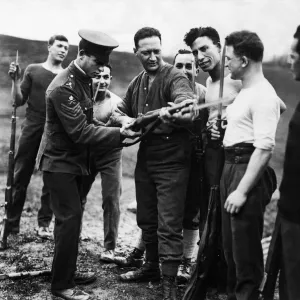 A member of the Royal Army Physical Training Corps gives Mr Jacob Epstein