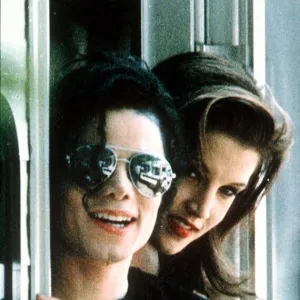 Michael Jackson pop Singer wearing dark glasses With Lisa Marie Presley