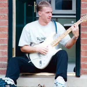 Middlesbrough player Robbie Mustoe seen here playing his electric guitar