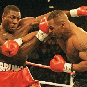 Mike Tyson launchers an attack on Frank Bruno during the WBC world title fight in Las