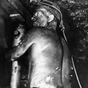 Miner setting a prop at Rossington Colliery, April 1970 Print