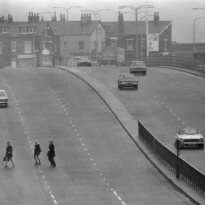 People crossing the motorway dangerously, in a black and white print People crossing the motorway dangerously, in a black and white print