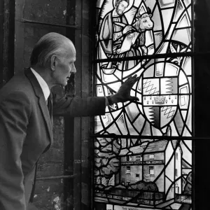 Black and white print of Patrick Feeny examining a stained glass window Black and white print of Patrick Feeny examining a stained glass window
