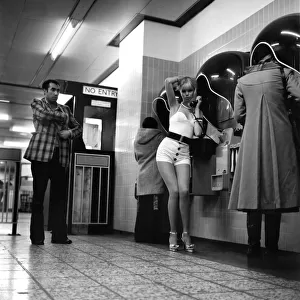Model Christine Donna seen here using the public telephones at Holborn tube station