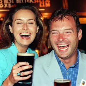 Model Eileen Catterson and TV Presenter John Leslie having some fun at the launch of