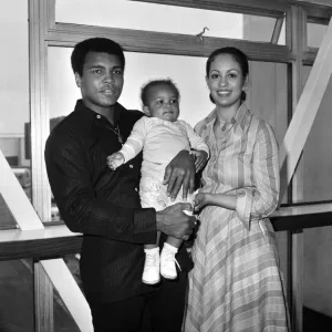 Mohammad Ali pictured with his wife Veronica and baby Hanna at Heathrow Airport today