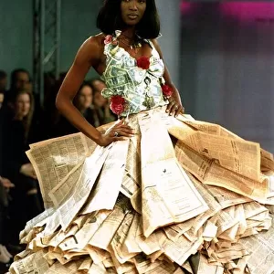 Naomi Campbell wearing a newspaper and money dress at the Clothing Brition Fashion Show