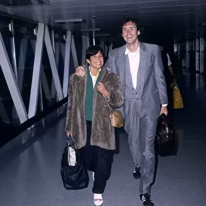 Nigel Planer Actor arriving at London Airport from Barbados with his wife Roberta Planer
