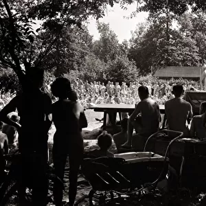 Nudist Beauty Contest - August 1957 people gather round a stage to view contestants