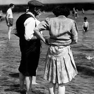 Old People on beach, bank, river bank family holiday. Unknown date