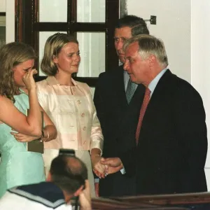 Outgoing governor of Hong Kong Chris Patten comforts memebers of his family Alice