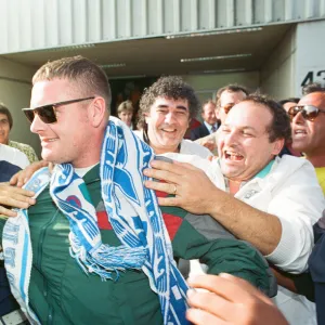 Paul Gascoigne is mobbed by airport workers and Lazio fans on arrival in Rome