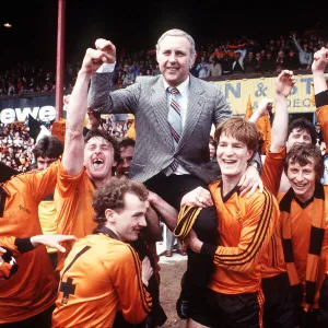 Paul Hegarty and Richard Gough give their manager a lift as they hold up Dundee United