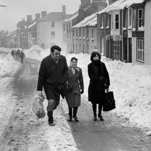 Pedestrians make their way along the main street of Cowbridge after the road had at last