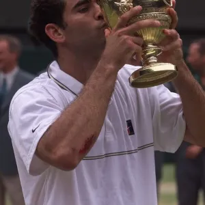 Pete Sampras kisses trophy after victory at Wimbledon 1999 after beating Andre Agassi in