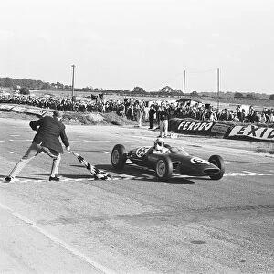 Peter Arundell in his Lotus 22 takes the checkered flag to win the Molyslip Trophy / IV