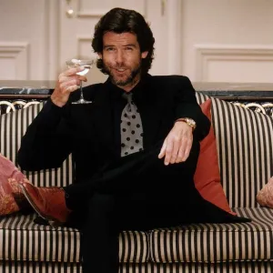 Pierce Brosnan Actor with a glass of Champagne