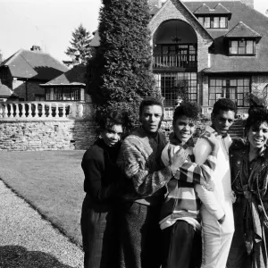 Pop group Five Star outside their new home Stone Court in Berkshire. March 1987