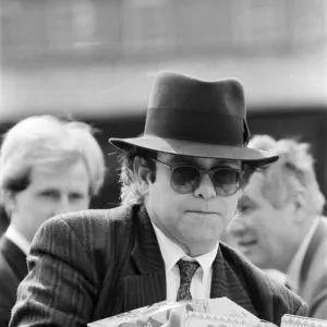 Pop star and Watford FC Chairman, Elton John, handing out Easter eggs to fans