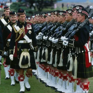 Prince Charles Prince of Wales inspecting troops with highland uniform / kilt at Fort