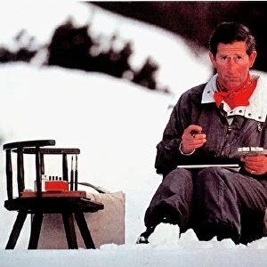 Prince Charles sits down and paint during an Alpine skiing holiday February 1994
