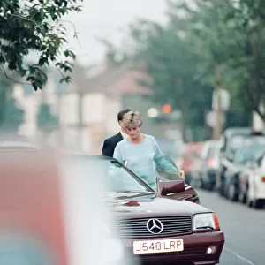 Princess Diana returns to car after visiting friend Carolyn Bartholmew, former flatmate