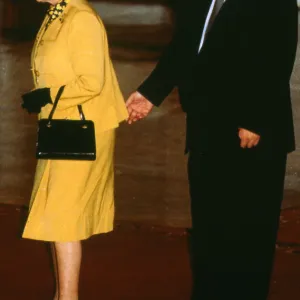 Queen Elizabeth with Boris Yeltsin standing behind and appearing to pinch the monarch