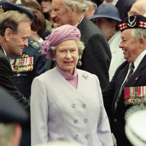 Queen Elizabeth II attends the unveiling of the Canadian War Memorial in Green Park