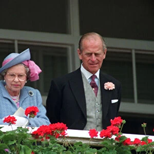 Queen Elizabeth II and Prince Philip watching the Derby horse race. June 1991
