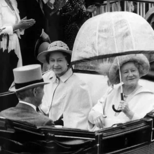 Queen Mother riding down the course with the Queen in an open top carriage in the Ascot