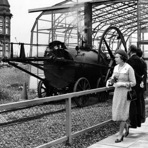 The Queen sees the working replica of Trevithicks Penydarren locomotive with curator