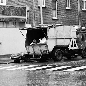 A refuse collector working on the Kings Road, London. 4th December 1970