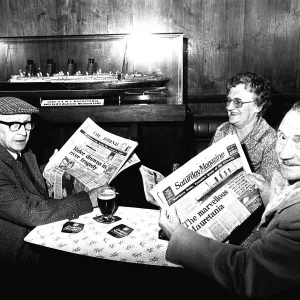 Three regulars at the Mauretania Pub in Wallsend, reading a copy of the Newcastle Journal