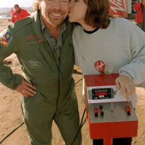 Richard Branson is kissed by one of the ground crew Virgin Global Challenger balloon