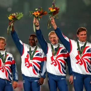 Roger Black of Great Britain celebrates with his teammates Mark Richardson