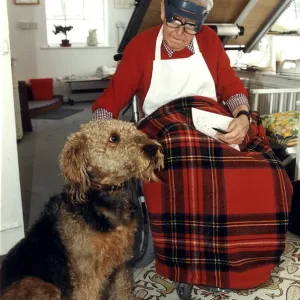 Ronald Carl Giles - Daily Express cartoonist at home in his studio with his dog Butch