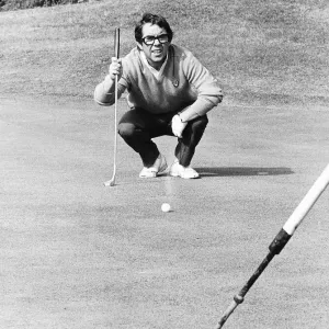 Ronnie Corbett Comedian crouches down to eye up a putt during a golf match dbase