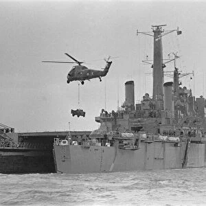 Royal Navy Ships HMS Fearless Assault Ship. A Wessex helicopter hovers over