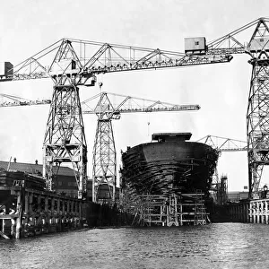 A ship being built at a shipyard along the River Tyne