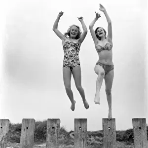 Shirley Eaton and Shirley Burniston seen here modelling a bikini and all in one Swim suit