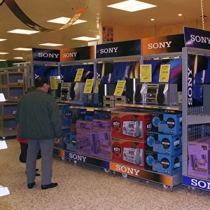 Shops Shopping Sony Hifi Stand in Tesco Nov 1998 Shoppers in Supermarket looking