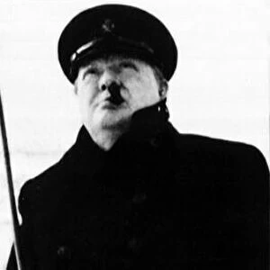 Sir Winston Churchill - British Prime Minister, in uniform and hat, smoking cigar